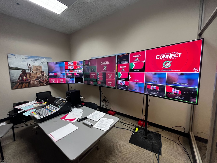 Control room setup with multiple screens displaying Samaritan's Purse Connect Conference virtual conference feeds.